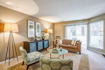 a living room with a couch and chairs at Valley Plaza Villages, California, 94566